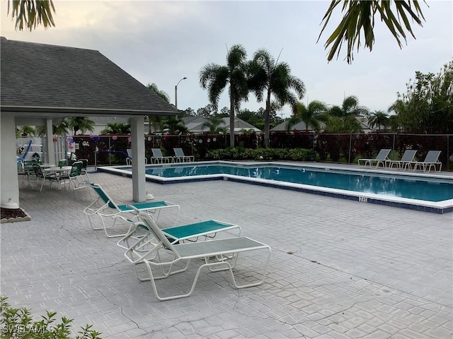 18437 Orangecrest Ct, Lehigh Acres, FL 33936 - community pool with a patio