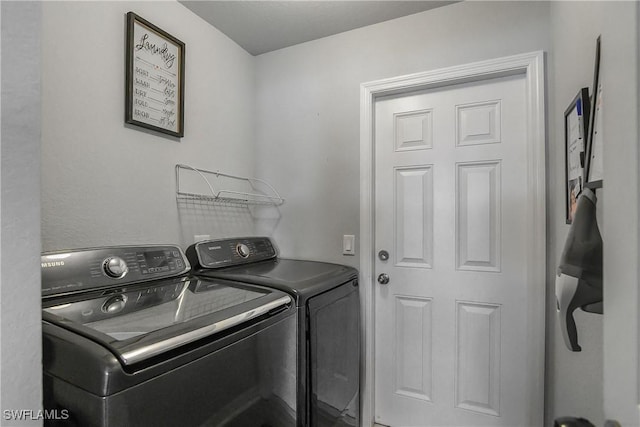 325 NE 24th Ter, Cape Coral, FL 33909 - washroom featuring washing machine and dryer