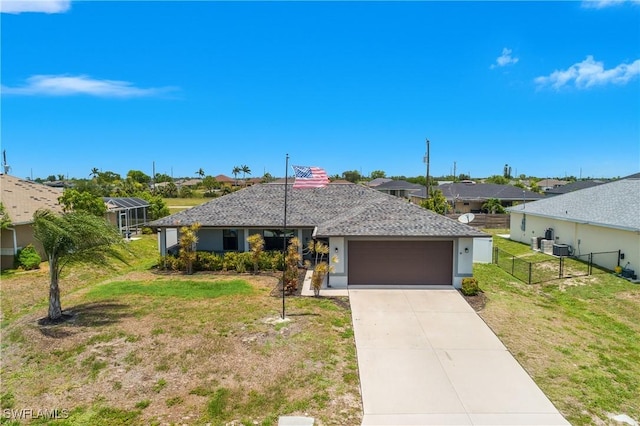325 NE 24th Ter, Cape Coral, FL 33909 - single story home featuring an attached garage, driveway, a residential view, and stucco siding