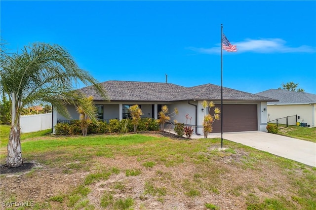 325 NE 24th Ter, Cape Coral, FL 33909 - ranch-style house with an attached garage, driveway, and stucco siding