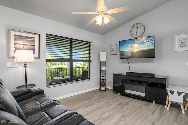 325 NE 24th Ter, Cape Coral, FL 33909 - living room with wood finished floors, lofted ceiling, a ceiling fan, and baseboards