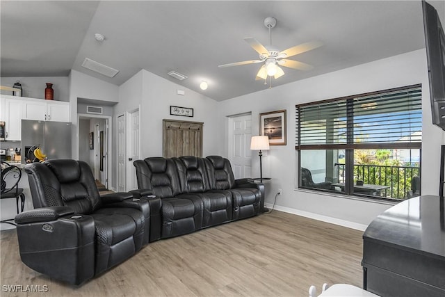 325 NE 24th Ter, Cape Coral, FL 33909 - living room with vaulted ceiling, ceiling fan, light wood finished floors, and baseboards
