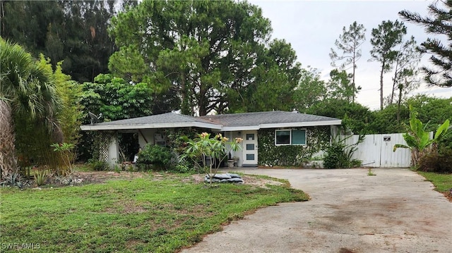 2206 Wyandotte Ave, Alva, FL 33920 - view of front of home featuring driveway, a gate, and a front lawn