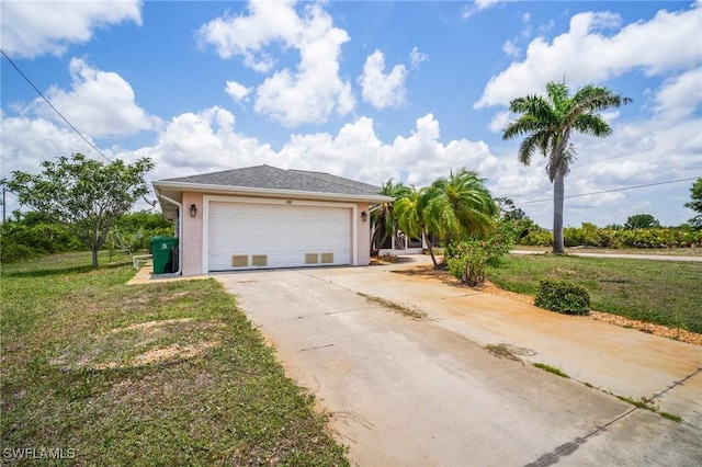 188 Ingram Blvd, Rotonda West, FL 33947 - view of front of home featuring driveway, stucco siding, and a front yard