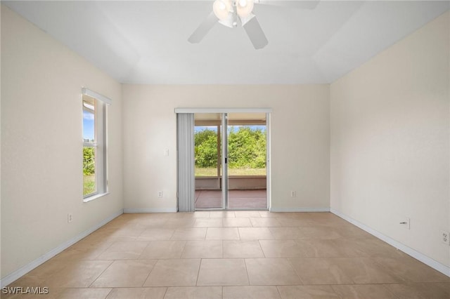 188 Ingram Blvd, Rotonda West, FL 33947 - unfurnished room with plenty of natural light, a ceiling fan, baseboards, and light tile patterned floors