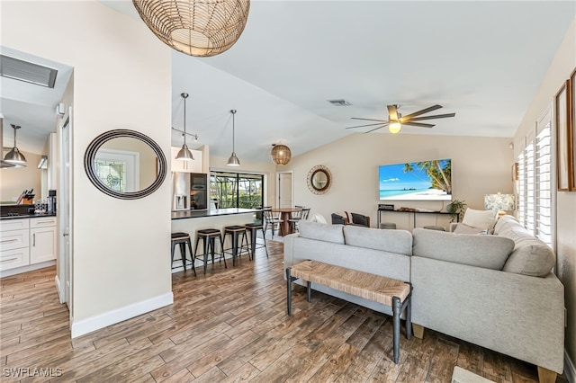 5630 Riverside Dr, Cape Coral, FL 33904 - living room with lofted ceiling, light wood-style flooring, ceiling fan, and baseboards