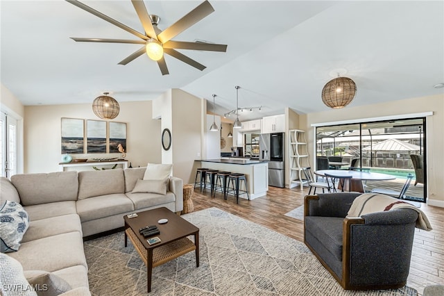 5630 Riverside Dr, Cape Coral, FL 33904 - living area with a ceiling fan, plenty of natural light, wood finished floors, and lofted ceiling