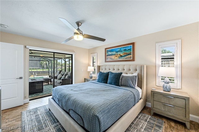 5630 Riverside Dr, Cape Coral, FL 33904 - bedroom with access to exterior, wood finished floors, baseboards, and ceiling fan