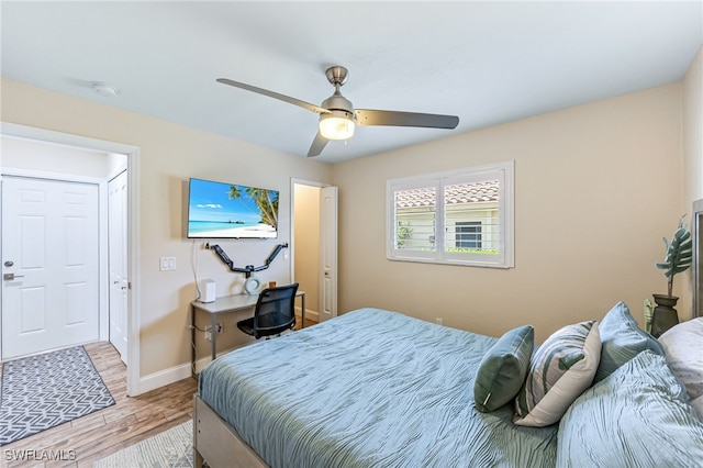 5630 Riverside Dr, Cape Coral, FL 33904 - bedroom with light wood-style floors, baseboards, and a ceiling fan