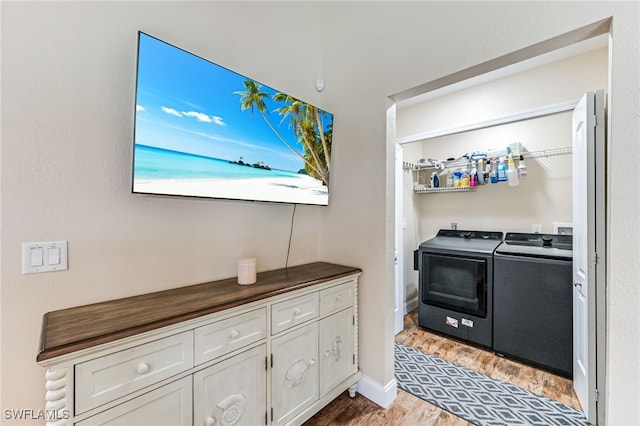 5630 Riverside Dr, Cape Coral, FL 33904 - laundry area with washing machine and dryer and light wood finished floors