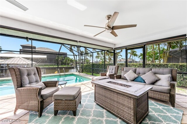 5630 Riverside Dr, Cape Coral, FL 33904 - view of patio / terrace with an outdoor living space with a fire pit, an outdoor pool, a ceiling fan, and a lanai