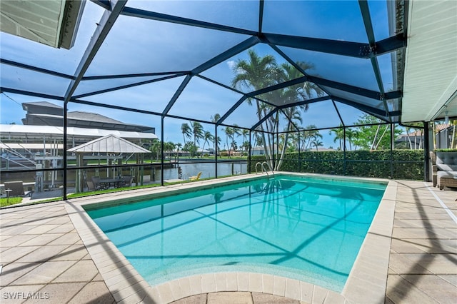 5630 Riverside Dr, Cape Coral, FL 33904 - outdoor pool with a water view, a patio, and glass enclosure