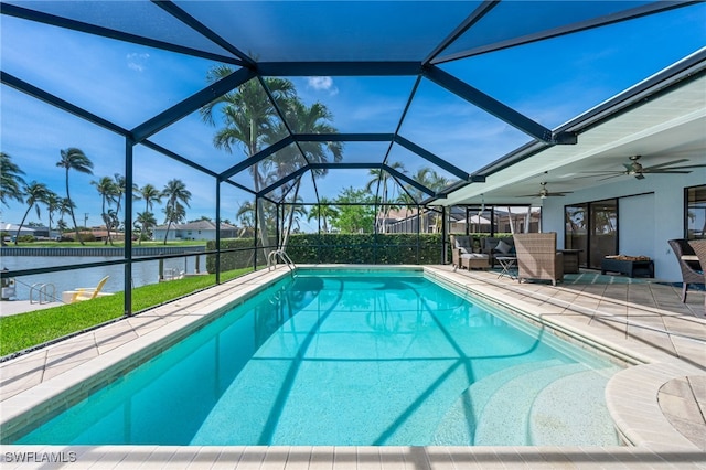 5630 Riverside Dr, Cape Coral, FL 33904 - view of pool with a patio area, ceiling fan, a water view, outdoor lounge area, and glass enclosure