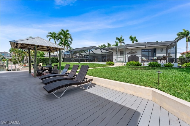 5630 Riverside Dr, Cape Coral, FL 33904 - wooden terrace featuring a lawn