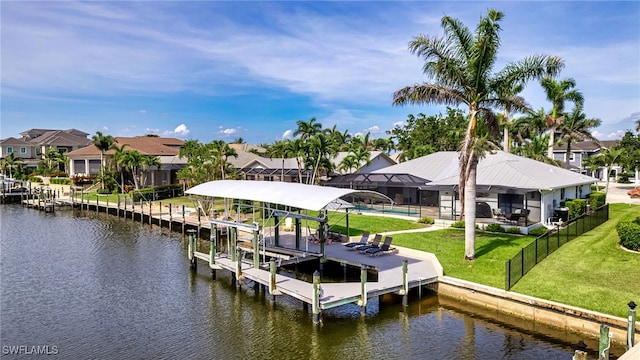 5630 Riverside Dr, Cape Coral, FL 33904 - dock featuring boat lift, a water view, a residential view, and a swimming pool