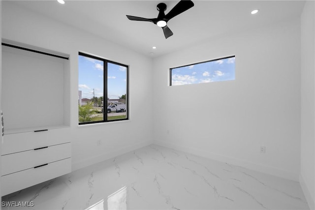 928 NE 8th Place, Cape Coral, FL 33909 - unfurnished bedroom with marble finish flooring, recessed lighting, baseboards, and ceiling fan