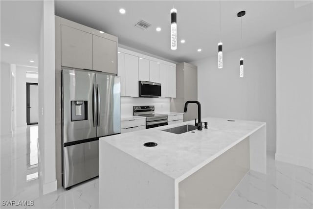 928 NE 8th Place, Cape Coral, FL 33909 - kitchen with stainless steel appliances, a sink, light marble finish flooring, modern cabinets, and recessed lighting