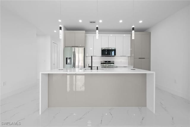 928 NE 8th Place, Cape Coral, FL 33909 - kitchen featuring appliances with stainless steel finishes, light marble finish floors, baseboards, a large island, and recessed lighting