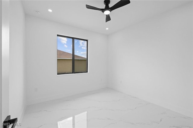 928 NE 8th Place, Cape Coral, FL 33909 - spare room with marble finish floors, recessed lighting, ceiling fan, and baseboards