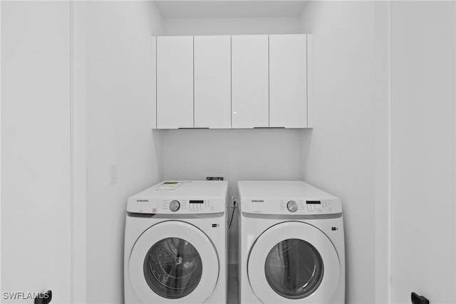 928 NE 8th Place, Cape Coral, FL 33909 - laundry area with separate washer and dryer and cabinet space