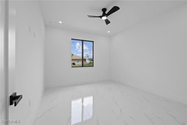 928 NE 8th Place, Cape Coral, FL 33909 - empty room featuring marble look tile flooring, baseboards, recessed lighting, and a ceiling fan