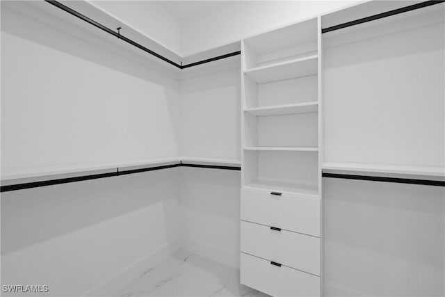 928 NE 8th Place, Cape Coral, FL 33909 - spacious closet featuring light marble finish floors