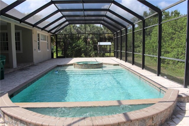 4150 Enclave Pl, Punta Gorda, FL 33980 - view of swimming pool with a pool with connected hot tub, a patio, and glass enclosure