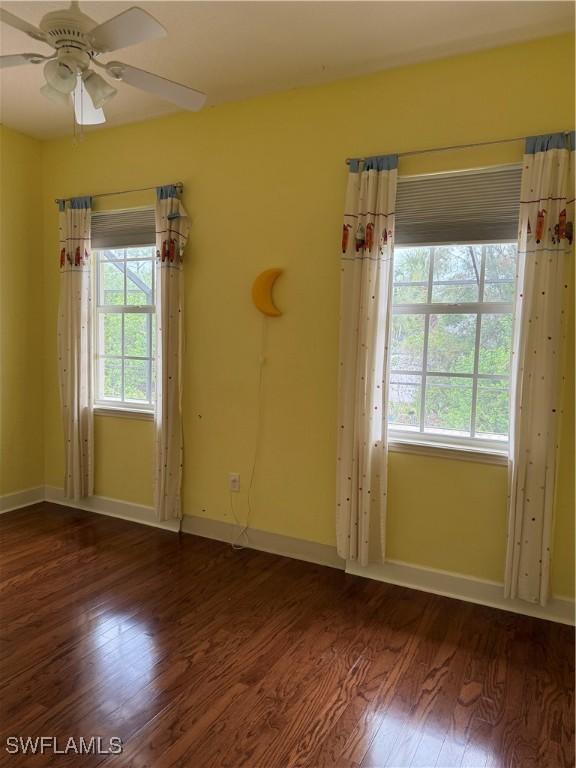 4150 Enclave Pl, Punta Gorda, FL 33980 - unfurnished room featuring wood finished floors, a ceiling fan, and baseboards