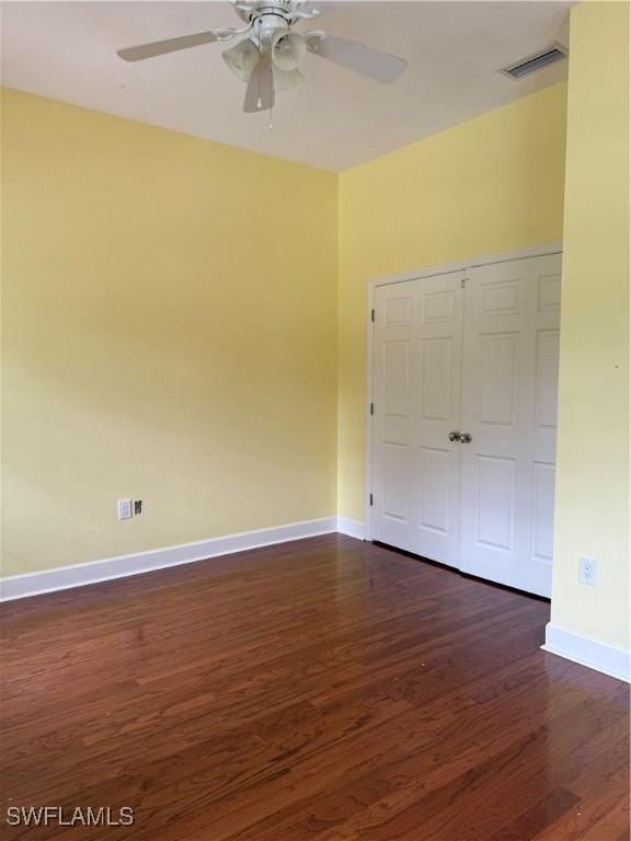 4150 Enclave Pl, Punta Gorda, FL 33980 - spare room with dark wood-style floors, baseboards, and ceiling fan