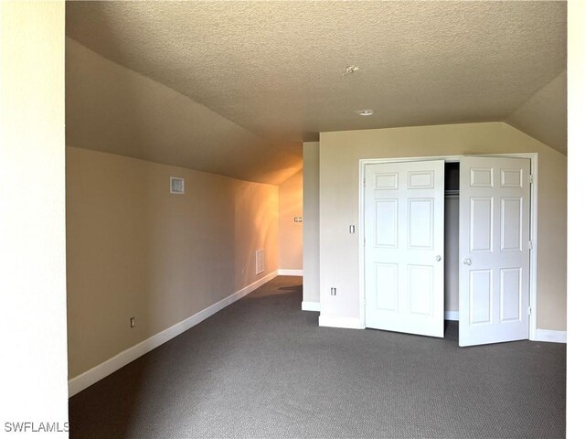 4150 Enclave Pl, Punta Gorda, FL 33980 - bonus room featuring lofted ceiling, dark carpet, and baseboards