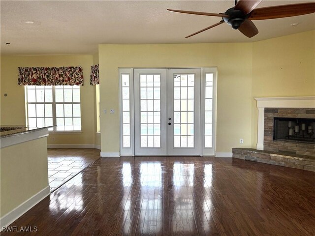 4150 Enclave Pl, Punta Gorda, FL 33980 - unfurnished living room with a ceiling fan, baseboards, and wood finished floors