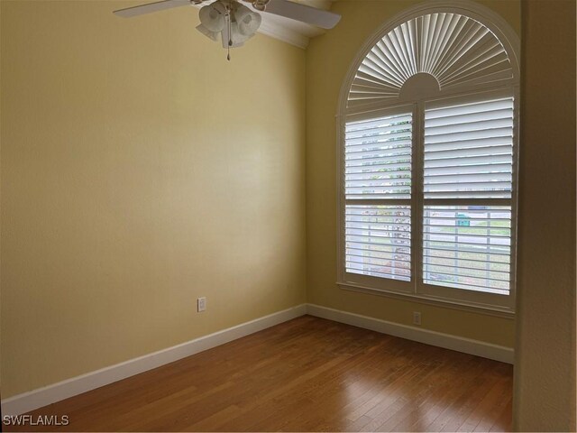 4150 Enclave Pl, Punta Gorda, FL 33980 - unfurnished room with baseboards, wood finished floors, and ceiling fan