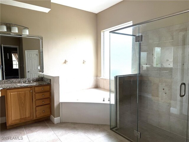4150 Enclave Pl, Punta Gorda, FL 33980 - full bath with vanity, a bath, a shower stall, and tile patterned flooring