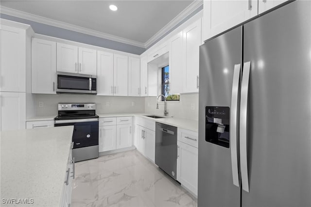 570 Sherwood Ave S, Lehigh Acres, FL 33974 - kitchen featuring appliances with stainless steel finishes, a sink, crown molding, light marble finish floors, and white cabinetry