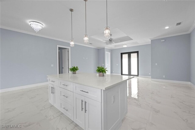 570 Sherwood Ave S, Lehigh Acres, FL 33974 - kitchen featuring light marble finish flooring, crown molding, a ceiling fan, white cabinets, and decorative light fixtures