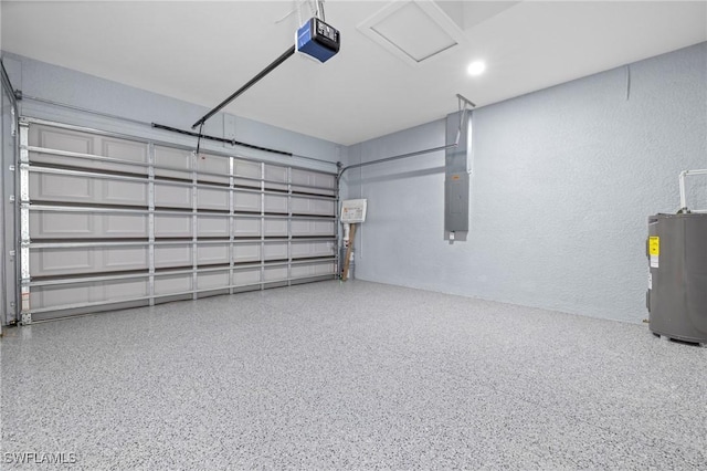 570 Sherwood Ave S, Lehigh Acres, FL 33974 - garage with electric water heater, a garage door opener, and a textured wall