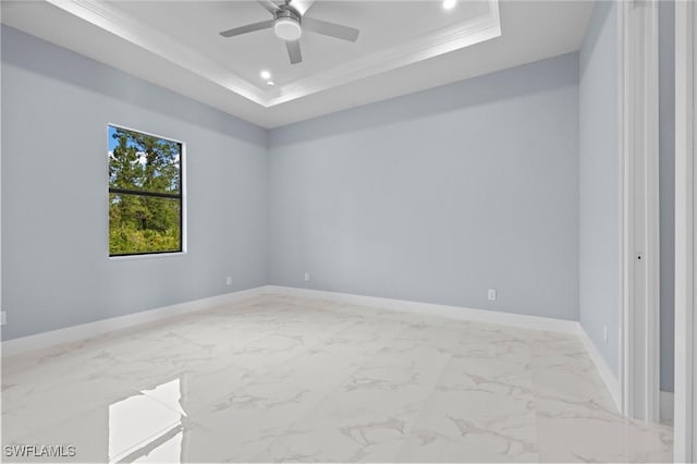 570 Sherwood Ave S, Lehigh Acres, FL 33974 - empty room featuring a tray ceiling, ornamental molding, a ceiling fan, baseboards, and recessed lighting
