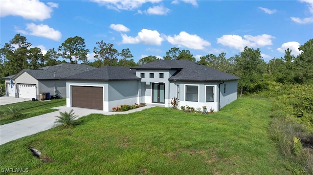 570 Sherwood Ave S, Lehigh Acres, FL 33974 - view of front of home with stucco siding, driveway, an attached garage, a front lawn, and french doors