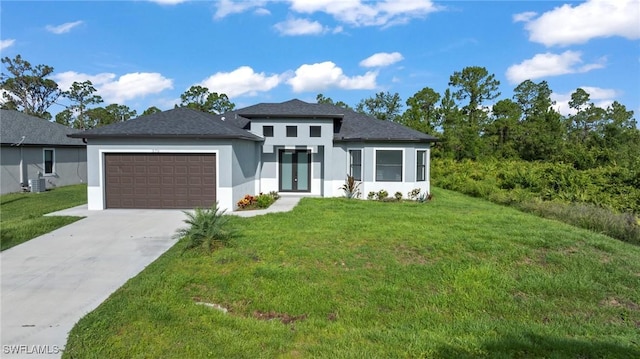 570 Sherwood Ave S, Lehigh Acres, FL 33974 - prairie-style home with stucco siding, an attached garage, driveway, a front lawn, and central AC unit