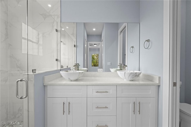 570 Sherwood Ave S, Lehigh Acres, FL 33974 - bathroom featuring a marble finish shower, toilet, and double vanity
