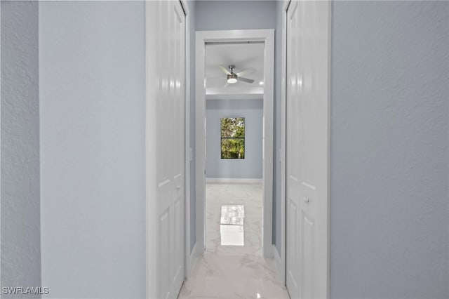 570 Sherwood Ave S, Lehigh Acres, FL 33974 - hall with marble finish flooring and a textured wall