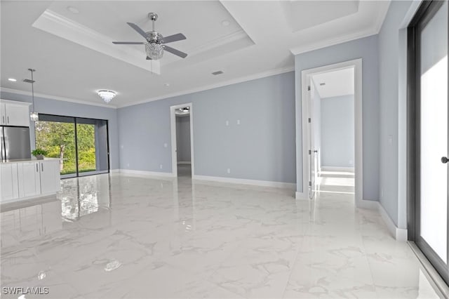 570 Sherwood Ave S, Lehigh Acres, FL 33974 - unfurnished room featuring a tray ceiling, baseboards, light marble finish floors, a ceiling fan, and ornamental molding