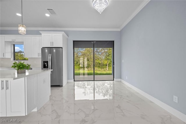570 Sherwood Ave S, Lehigh Acres, FL 33974 - kitchen featuring stainless steel fridge, light marble finish floors, healthy amount of natural light, white cabinetry, and crown molding
