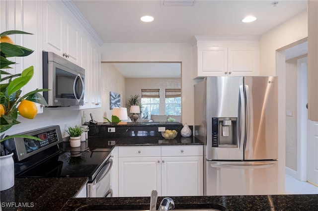 2080 W 1st St Unit 206, Fort Myers, FL 33901 - kitchen featuring appliances with stainless steel finishes, white cabinetry, dark stone counters, a sink, and recessed lighting