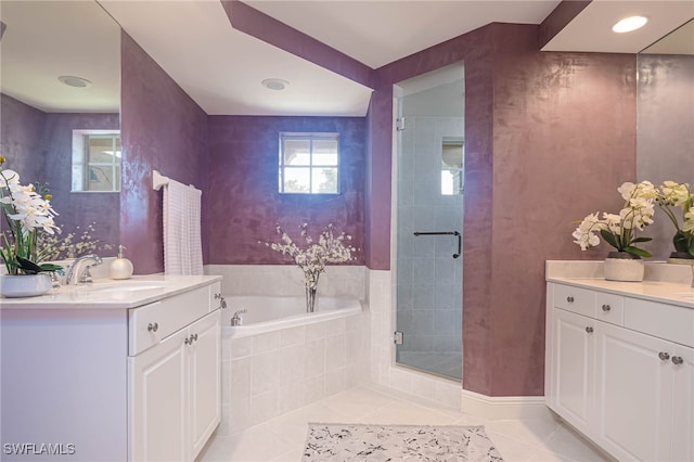 2080 W 1st St Unit 206, Fort Myers, FL 33901 - full bathroom featuring tile patterned flooring, vanity, a garden tub, and a stall shower