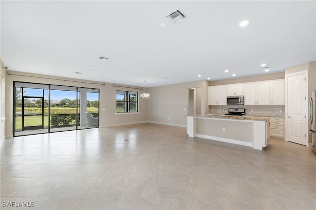 17021 Ashcomb Way, Estero, FL 33928 - unfurnished living room featuring light tile patterned floors and recessed lighting