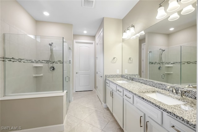 17021 Ashcomb Way, Estero, FL 33928 - full bath featuring a stall shower, double vanity, and recessed lighting