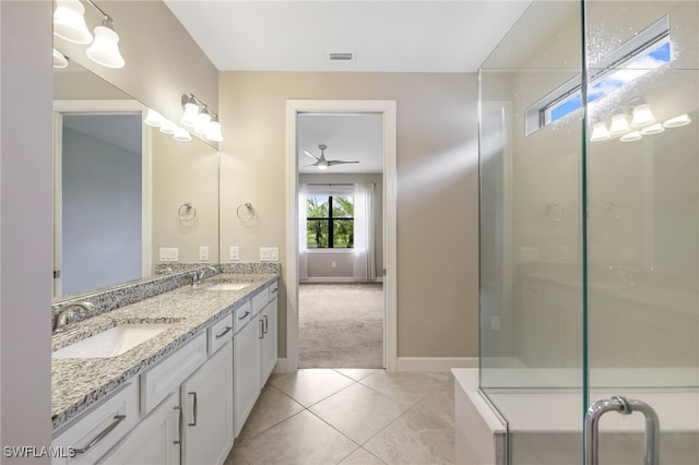 17021 Ashcomb Way, Estero, FL 33928 - full bath featuring double vanity, a ceiling fan, an enclosed shower, and tile patterned floors