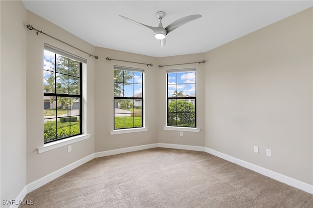 17021 Ashcomb Way, Estero, FL 33928 - empty room featuring carpet, healthy amount of natural light, and ceiling fan