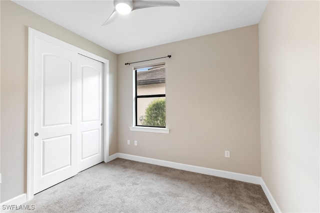 17021 Ashcomb Way, Estero, FL 33928 - unfurnished bedroom with carpet flooring, ceiling fan, and a closet
